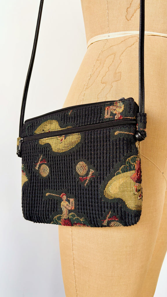 Black crossbody bag with colorful pattern on a mannequin